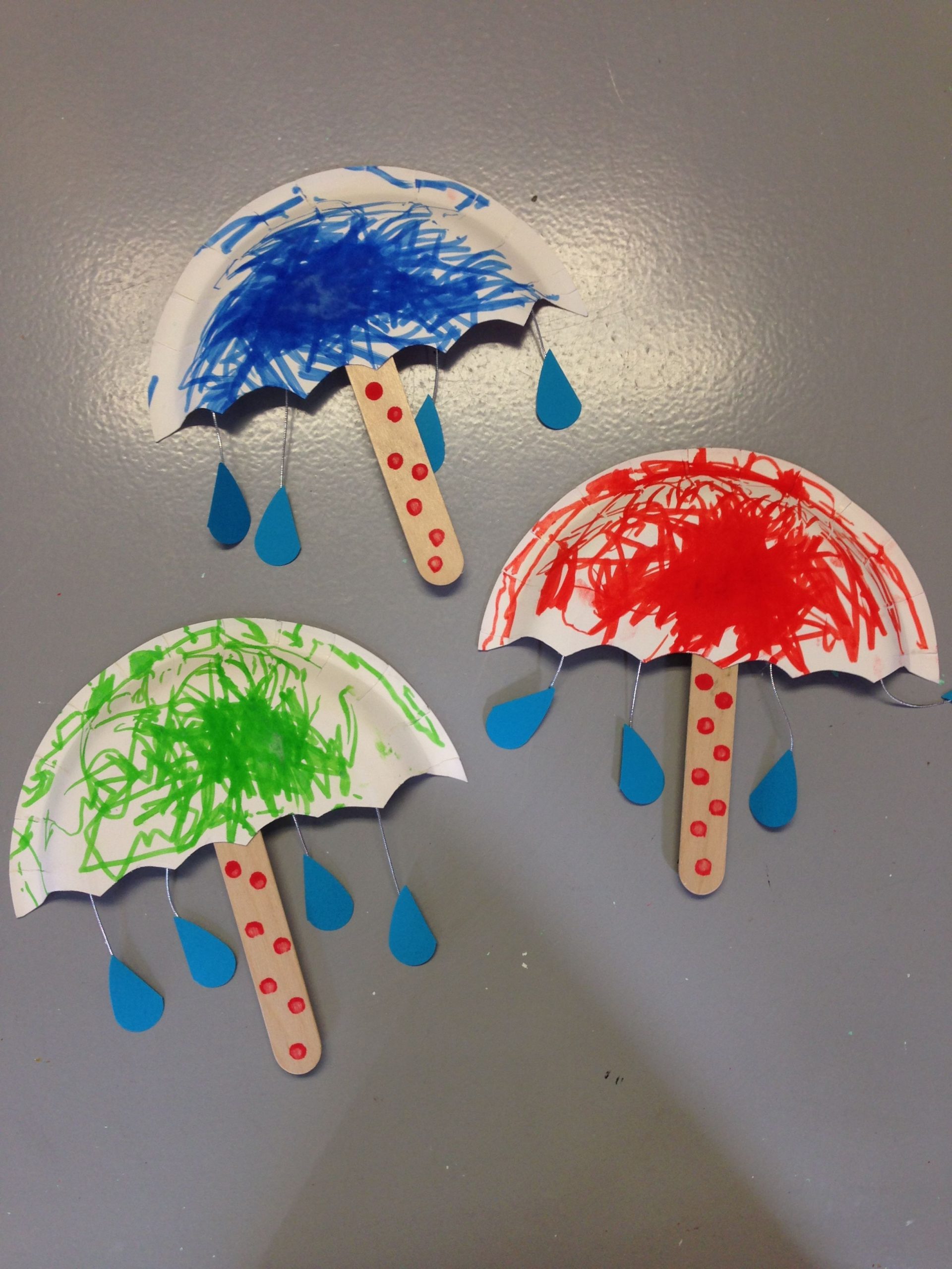 Preschool Crafts Three Paper Umbrellas Painted In Different Colors On 